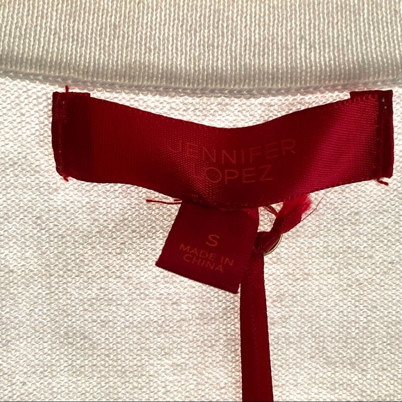 Jennifer Lopez Criss Cross Cut Out Off-White Sweater - Picture 7 of 12